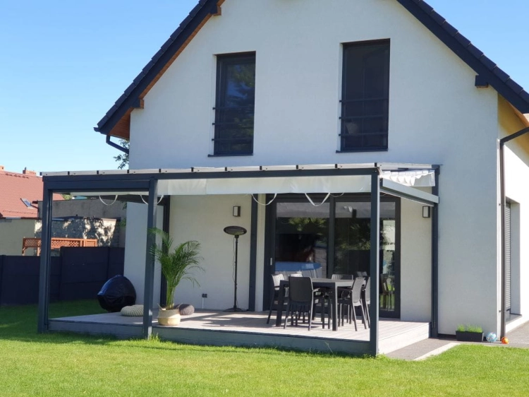 Roman blind for terrace 3x4 m premium waterproof sunshade on a grey aluminum pergola with patio furniture.