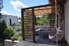 3x4 m waterproof premium roman blind canopy providing sun protection for a wooden garden terrace with lounge furniture