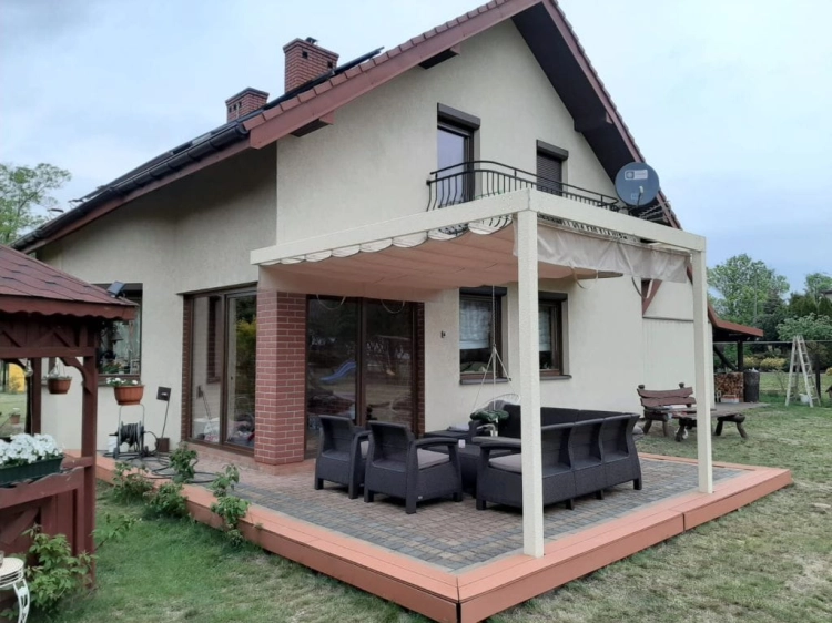 Cream 3x4 m retractable roman gazebo canopy over a modern outdoor patio set by a residential house house