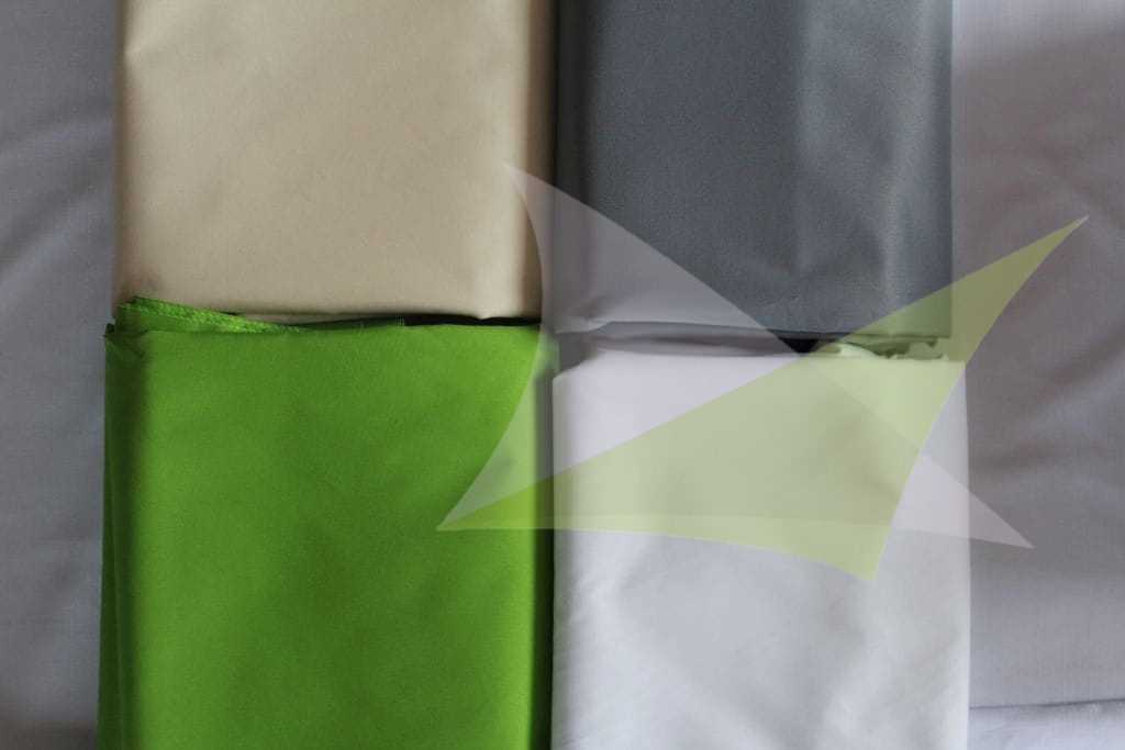 Four color swatches of waterproof premium sun sail fabric in beige, grey, green, and white.