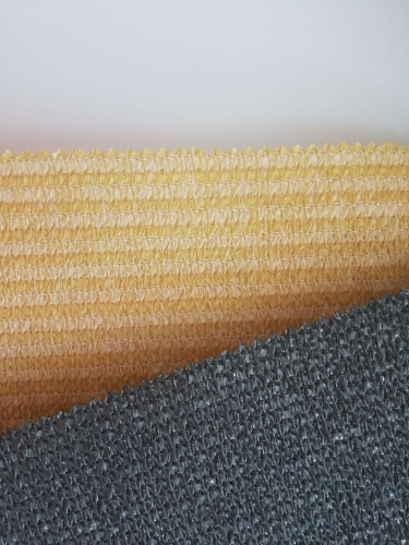 Close-up of beige and grey HDPE balcony screen swatches with breathable, UV-resistant mesh texture