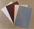 Kleuren PVC-doeken voor de productie van terrasoverkappingen: wit, bruin, beige en grijs.