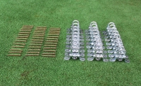 Set of silver metal D-ring mounting brackets and gold wood screws for a PVC terrace canopy installation on green turf