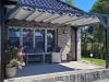 Grey Roman shade provides sun protection and waterproof coverage for a modern 3x4 m patio pergola setup