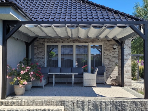 Premium 3x4 m waterproof retractable roman shade pergola awning in grey over a patio with wicker furniture