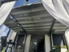 Premium grey outdoor roman blind installed on a white pergola terrace provides waterproof sun protection.
