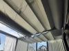 Gray retractable waterproof Roman blind for a 3x4 m terrace providing sun protection and outdoor shade.