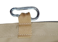 Close-up of a tan waterproof sun sail with a reinforced webbing loop and a metal carabiner for mounting