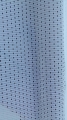 White mesh patio curtain fabric with a small perforated dot pattern in vertical rows.