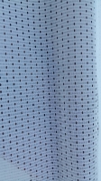 White mesh patio curtain fabric with a small perforated dot pattern in vertical rows.