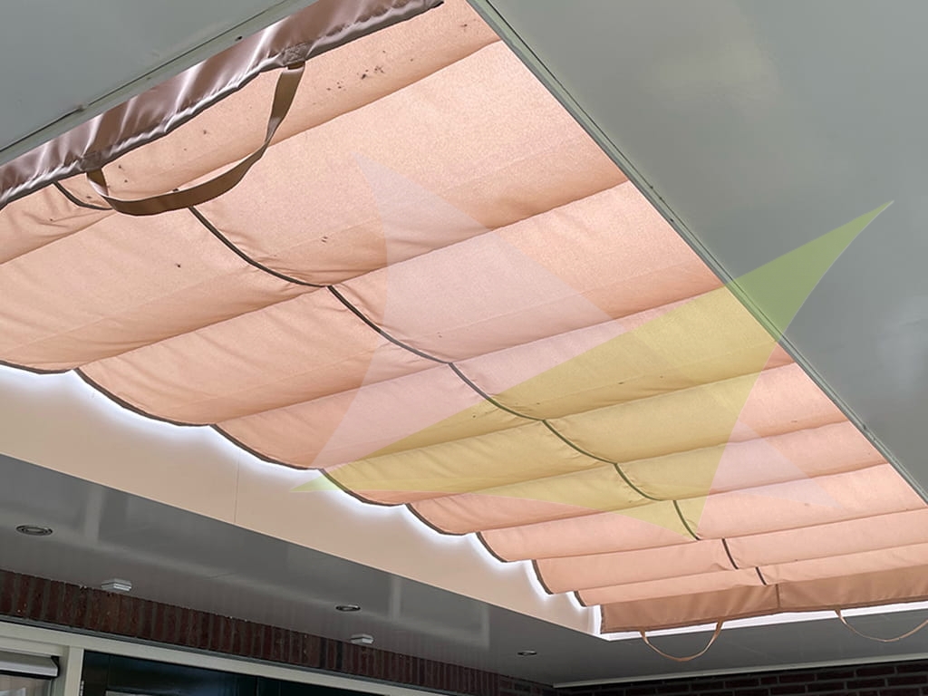 Premium sand-colored waterproof Roman blind installed as a retractable terrace shade.