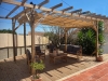Roman blind terrace awning 3x4 m waterproof premium sunshade on a wooden pergola with deck furniture