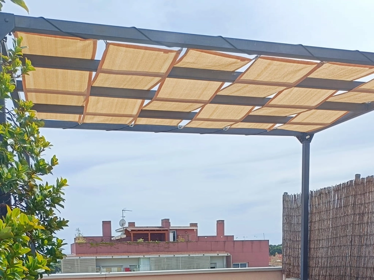 Custom-sized HDPE shade sail panels installed on a modern pergola frame for outdoor sun protection on a rooftop terrace