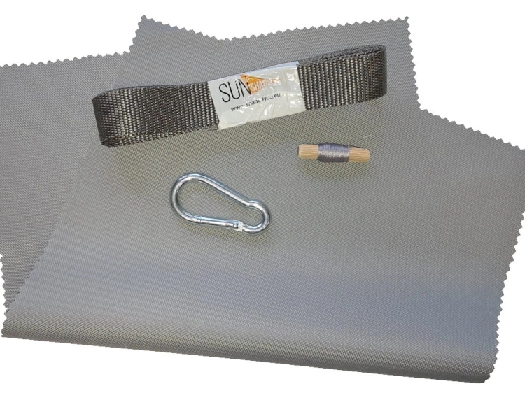 Sunshade repair and modification kit with grey fabric, webbing strap, carabiner, and thread spool on a white background