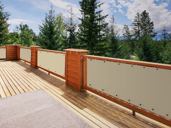 Premium waterproof custom balcony privacy screen on a wooden deck rail with a forest view
