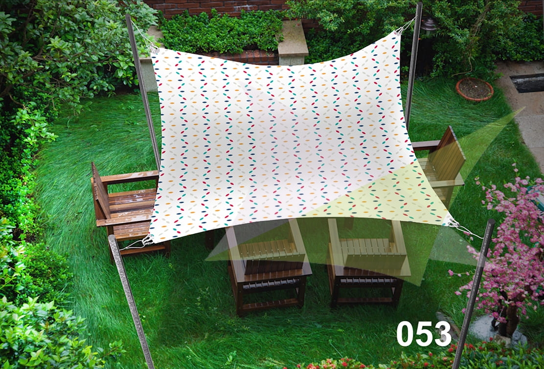 Waterproof 3x4.5m garden sun sail with colorful pattern sheltering wooden chairs on a green lawn