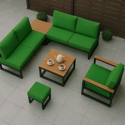 Fodere per cuscini da giardino verdi su un set di mobili da terrazza moderno con tavolino e poltrona