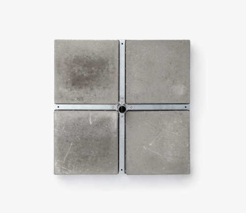 Top-down view of a sturdy square parasol base with four concrete slabs and a central metal pole holder.