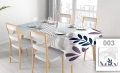 Custom rectangular tablecloth with abstract pattern on a modern dining table with four chairs and place settings