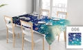 Custom floral pattern tablecloth in blue and teal colors on a set dining table with white chairs and dishes