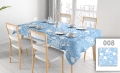 Custom light blue waterproof tablecloth with white floral pattern on a dining table with chairs and place settings.