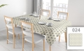 Stain-resistant rectangular tablecloth with a blue nautical ship wheel pattern on a table with white chairs and plates