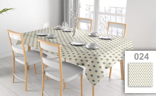 Stain-resistant rectangular tablecloth with a blue nautical ship wheel pattern on a table with white chairs and plates