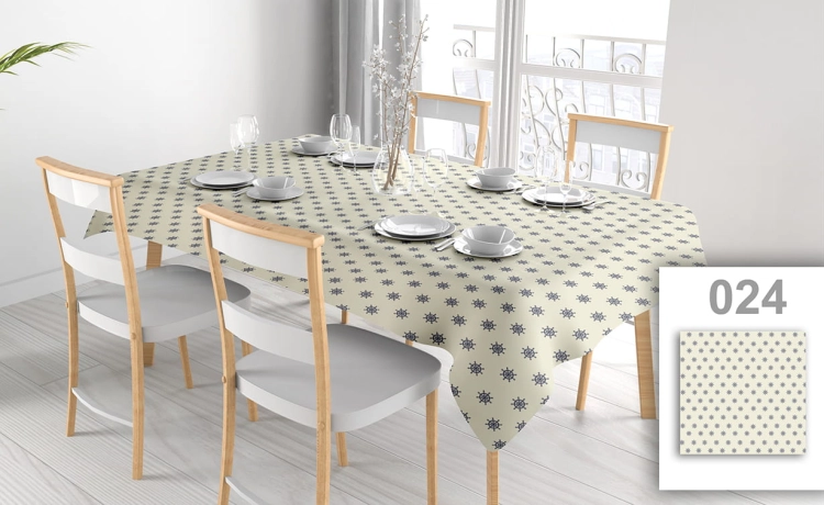 Stain-resistant rectangular tablecloth with a blue nautical ship wheel pattern on a table with white chairs and plates