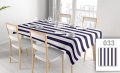 Custom printed waterproof tablecloth with navy and white stripes on a dining table with chairs and place settings