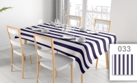 Custom printed waterproof tablecloth with navy and white stripes on a dining table with chairs and place settings