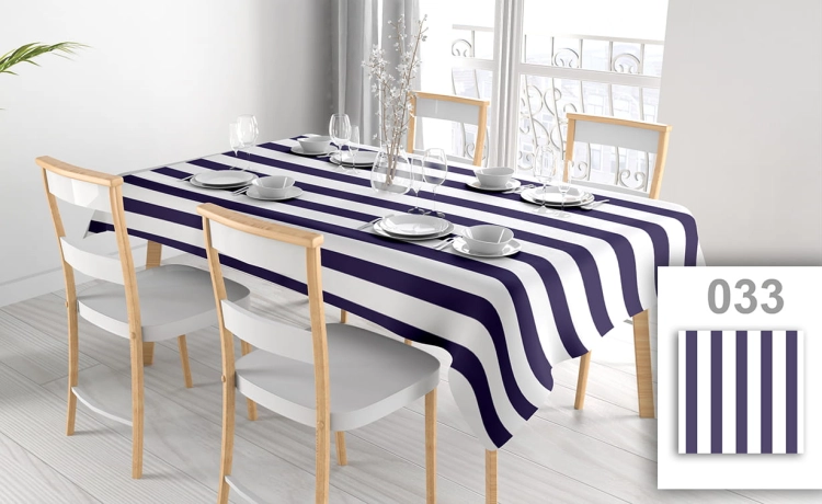 Custom printed waterproof tablecloth with navy and white stripes on a dining table with chairs and place settings