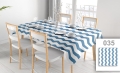 Custom size stain-resistant tablecloth with blue and white chevron pattern on a set dining table with chairs