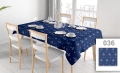 Custom tablecloth with nautical anchor pattern in navy blue and white on a dining table with chairs and place settings