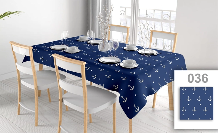 Custom tablecloth with nautical anchor pattern in navy blue and white on a dining table with chairs and place settings