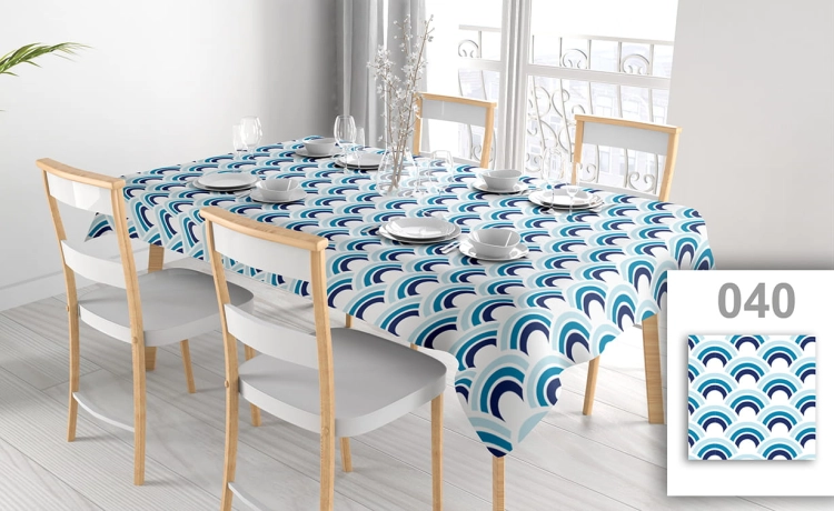 Custom printed waterproof tablecloth with blue wave pattern on a dining table with chairs and place settings