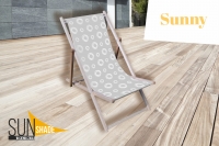 Wooden deck chair with a grey and white circle pattern on a light wood deck with Sunny and Sunshade logos.
