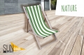 Wooden deck chair with green and white striped fabric on a light wood terrace with Sun Shade and Nature branding