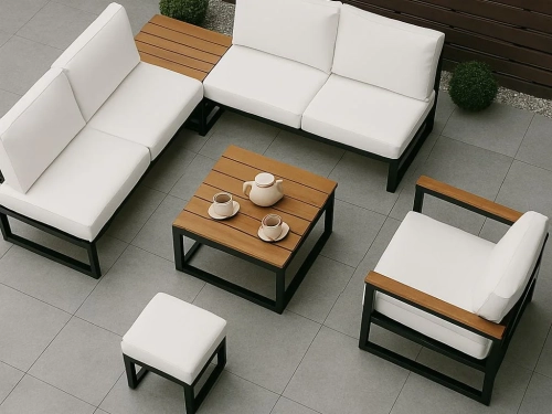 Outdoor furniture set with white waterproof cushions, wooden coffee table, and matching armchair on a patio.