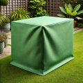 Green custom outdoor furniture cover protecting a rectangular garden table on a lawn.