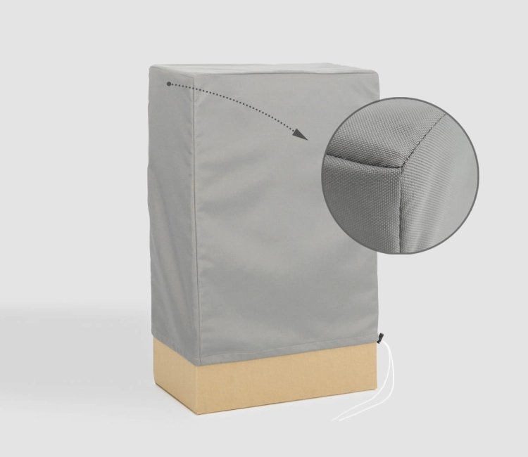Grey custom-made protective cover for outdoor garden furniture with a close-up on the durable fabric and stitched seam
