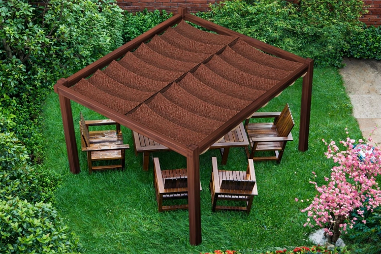 Retractable brown HDPE sun shade sail mounted on a wooden pergola over a garden dining set on a grassy lawn