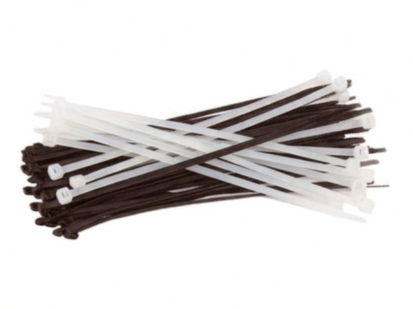 Bundle of black and white plastic cable ties on a white background