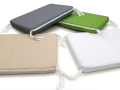 Assorted gray, lime green, tan, and white garden seat cushion covers with zippers and ties for outdoor furniture
