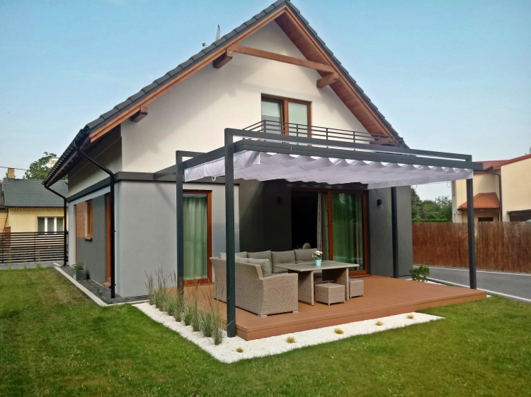 Premium retractable 3x4 m waterproof patio Roman blind provides shade over a modern outdoor lounge set and deck