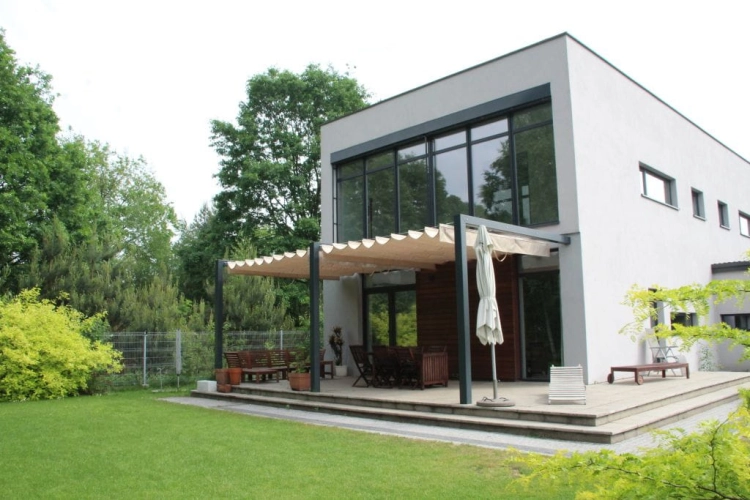 Beige 3x4 m retractable Roman patio awning canopy on a modern house terrace for sun and rain protection