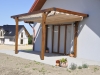 Premium waterproof 3x4 m roman terrace blind installed on a wooden pergola over a patio with sliding doors