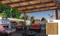 Wasserdichtes Sonnensegel für Pergola mit Bambusdruck über hellen Gartenmöbeln auf der Terrasse