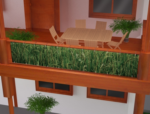 Privacy screen with wheat field print attached to a wooden balcony railing on a terrace with outdoor dining furniture