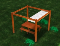 Retractable Roman gazebo shade sail over a wooden picnic table and pergola in a green lawn setting.