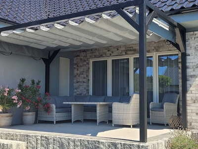 Horizontal Roman blind providing adjustable shade for a pergola